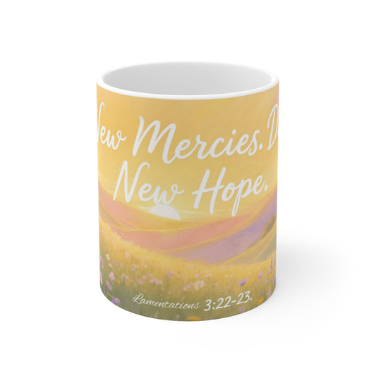 Mug with 'New Mercies, New Hope' text and scenic design on a white background